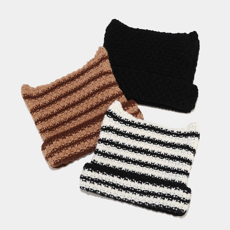 The Striped Knitted Beanie is a fun and stylish accessory perfect for a variety of occasions